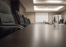 Empty executive conference room prepared for an industry roundtable on extraction regulation and manufacturing compliance.