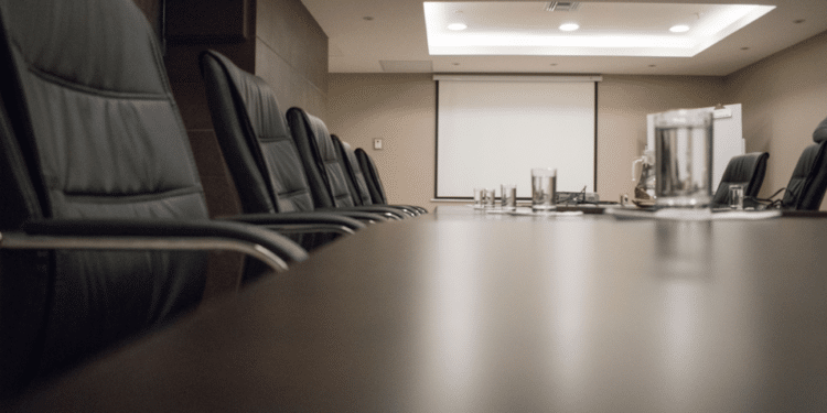 Empty executive conference room prepared for an industry roundtable on extraction regulation and manufacturing compliance.