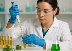 Laboratory technician using enzymes to extract natural compounds from plant material