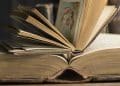 Two opened book in a historic library, close-up