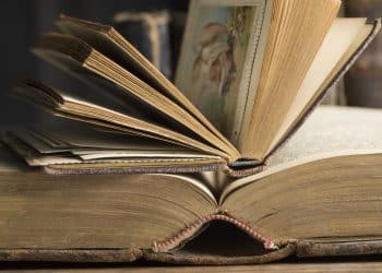 Two opened book in a historic library, close-up